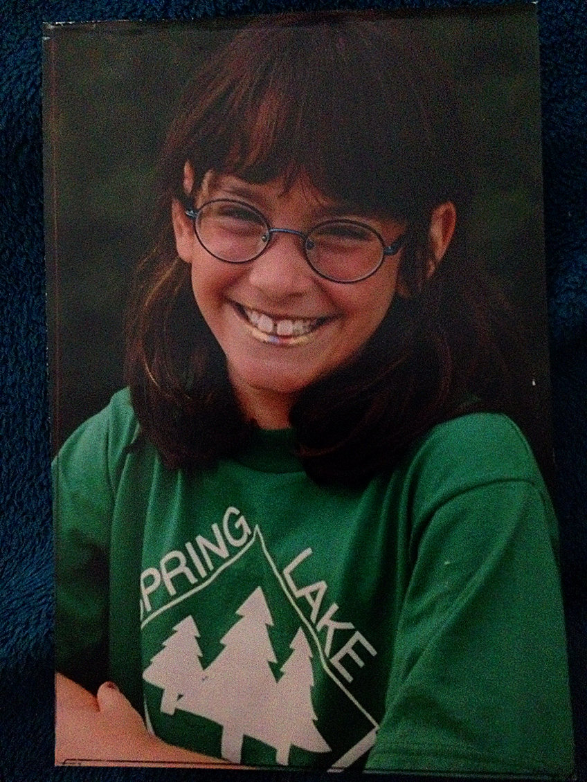 Here's another photographic gem: Me, about age 7, from Spring Lake Day Camp with four different shades of "hair mascara" on my head and matching stripes on my lips. 