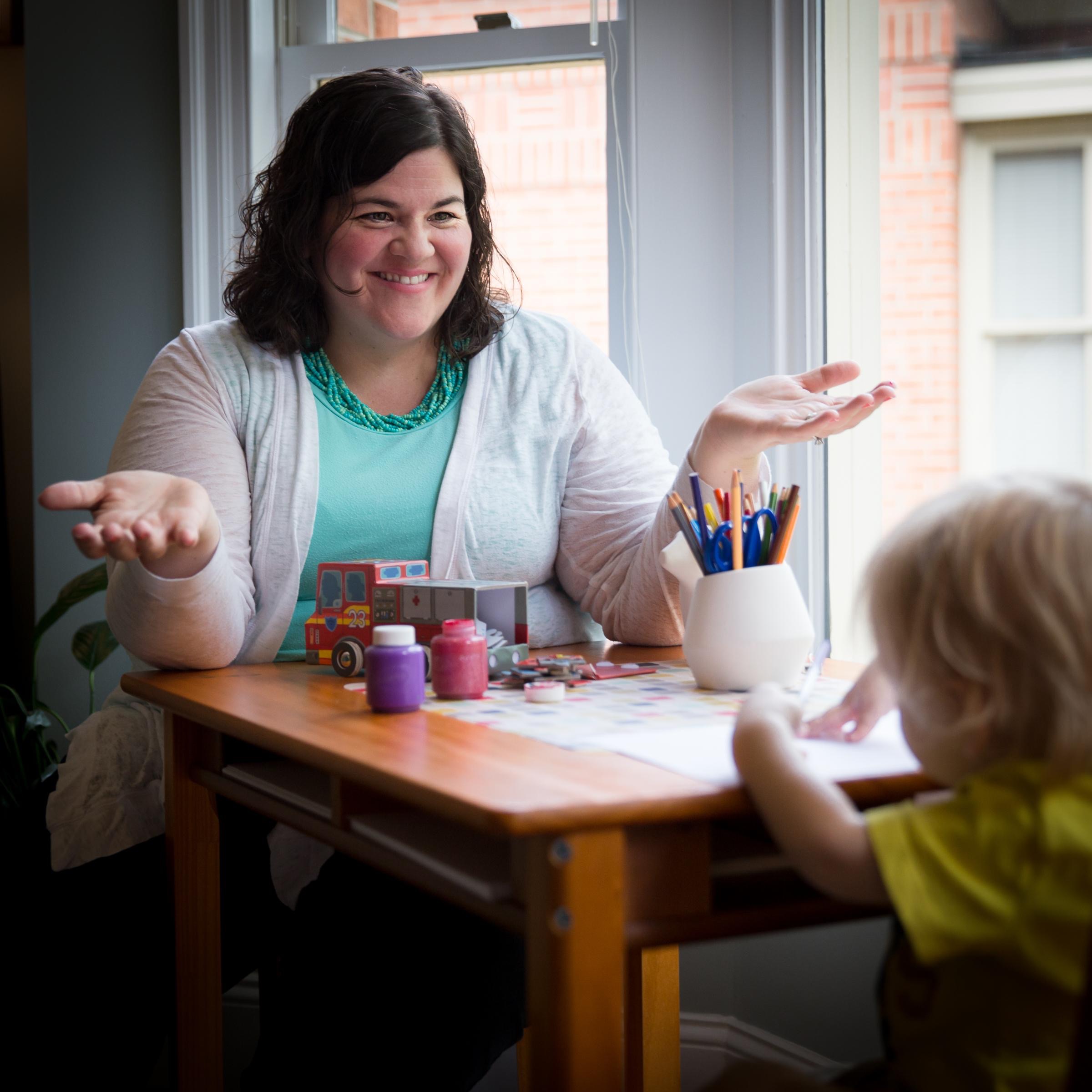 Christie Smith, LCSW lit up for the camera when she had an opportunity to interact with a child, a key element of her counseling practice. 