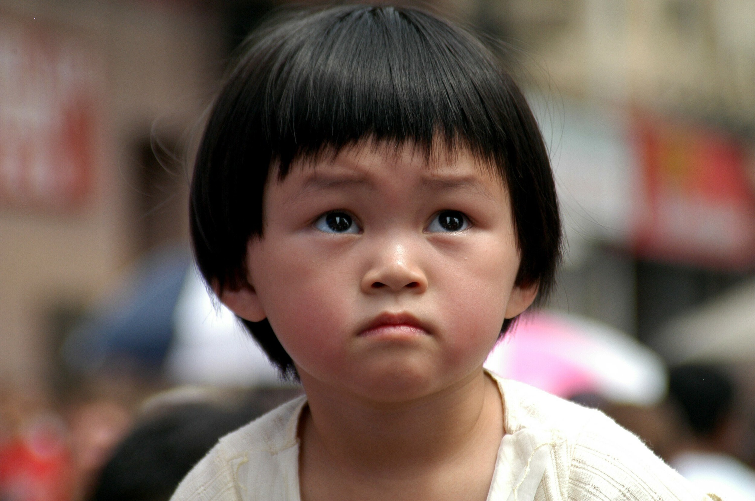 chinese boy staring at the chinatown festival.jpg