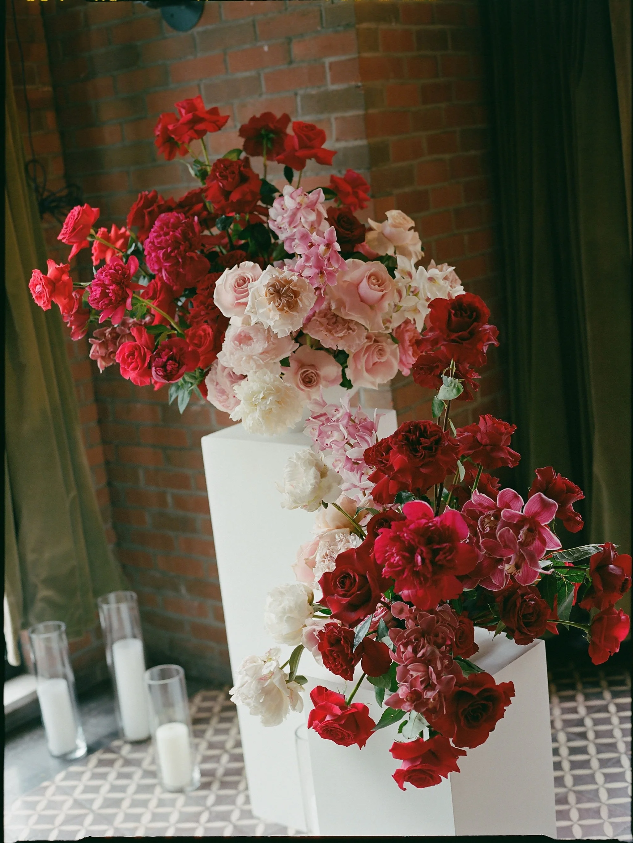 In the garden of life, a red rose is true romance in full bloom and for nora and bobby&rsquo;s wedding we leaned all the way into red and pink roses from the entry arrangement to the ceremony archway and dinner tables! so fun to reinvent such a class