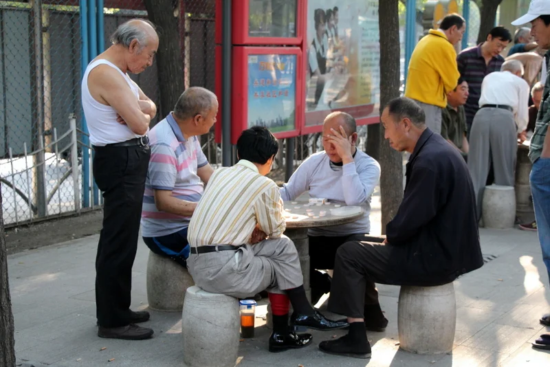 Just like in Boston's Chinatown, older men in China often sit outside playing Chinese Chess. Andrew learned to play last night with our couchsurfing hostess.