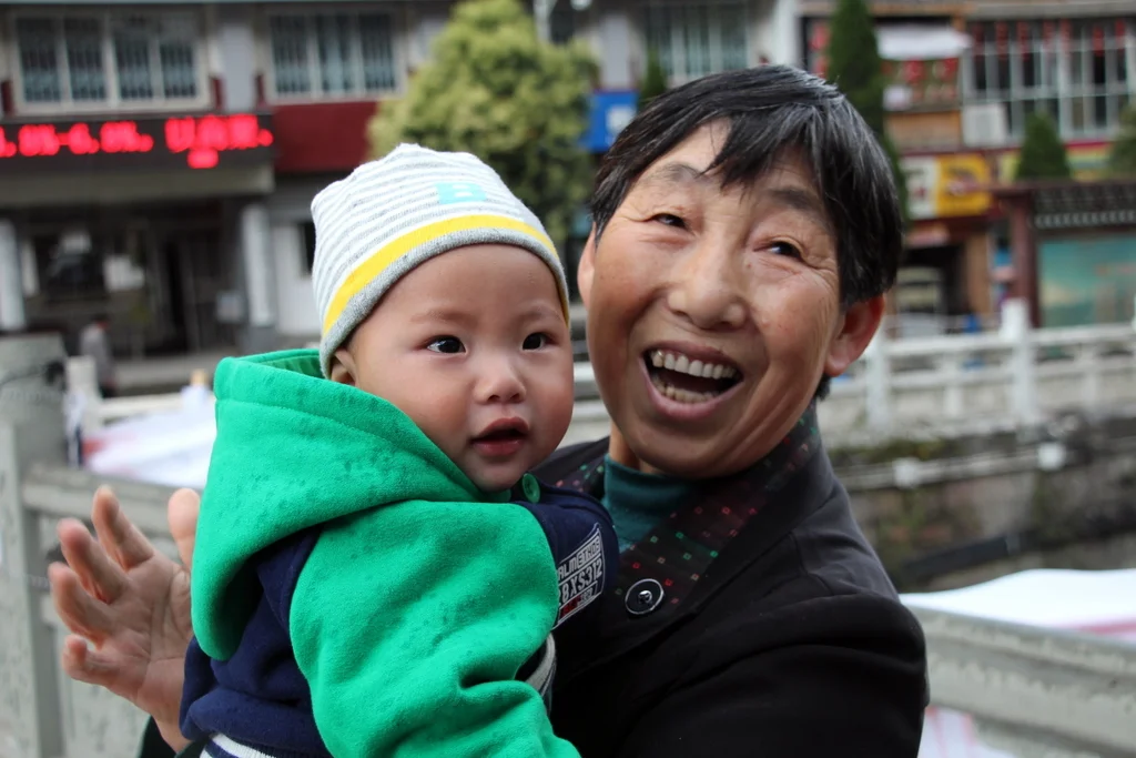 Babies and children in China love Andrew. I took a photo of this awesome baby and grandma.