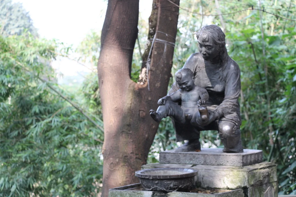 Chongqing: This fountain shows the position that Chinese people hold their toddlers so they can relieve themselves in the street. The fountain was off when we passed by but you can guess where the water comes out.
