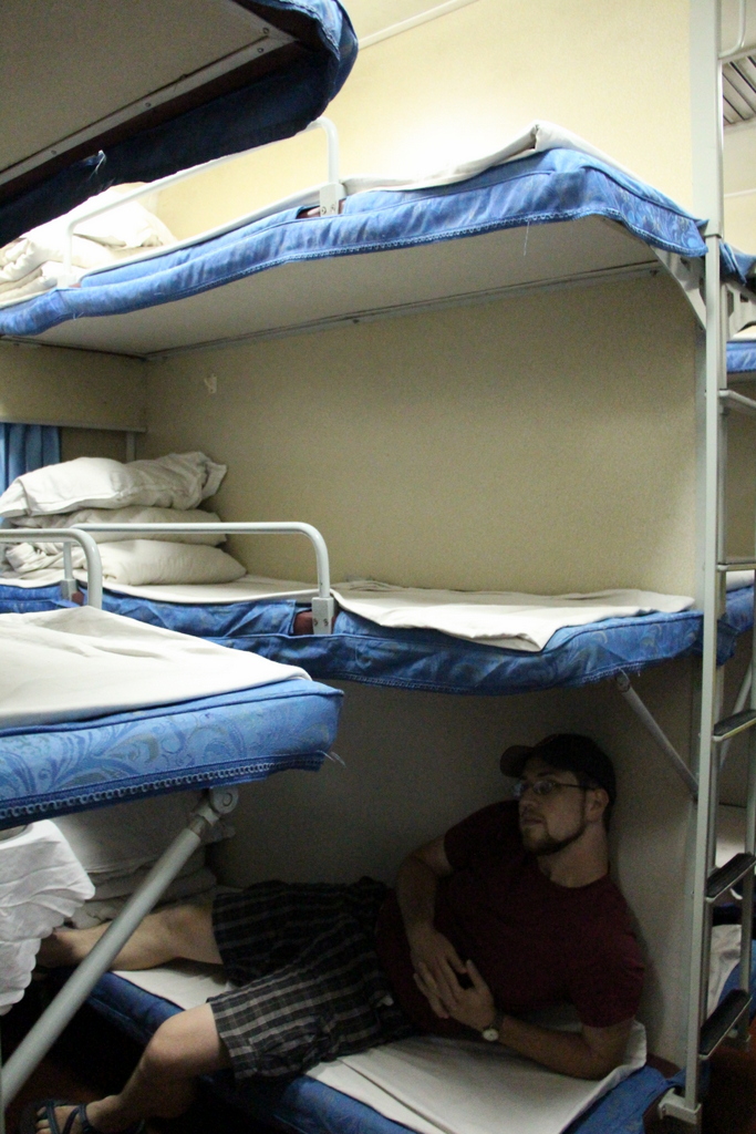 Andrew demonstrates the ample relaxation provided by the lower bunk in a hard sleeper