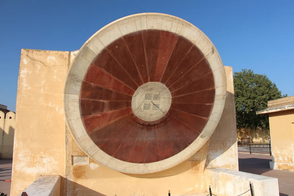 The center of this wheel has a metal pole that sticks out and casts a shadow that measures... uh... something.