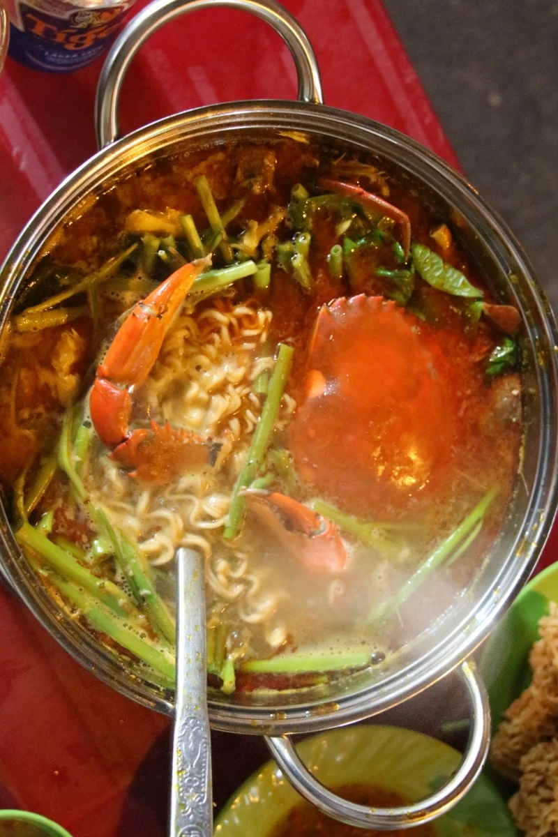 Crab hot pot with chopped morning glory and noodles. The broth was sweet and spicy, with a tomato-y flavor like tom yum soup. 4 scooters. It would have been 5 but the noodles were instant. 