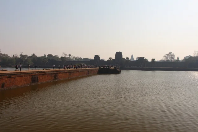 The view of the bridge that leads to Angkor Wat. This photo was taken on our way out of Akgkor Wat... After the sun had risen.