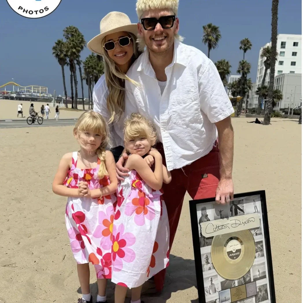 Award-winning, 2x GOLD-selling artist COLTON DIXON'S hit track "MIRACLES" has been certified Gold by the RIAA. PEOPLE.com recently covered the honor as his own little miracles, twin girls Athens and Dior, surprised him with the plaque and t