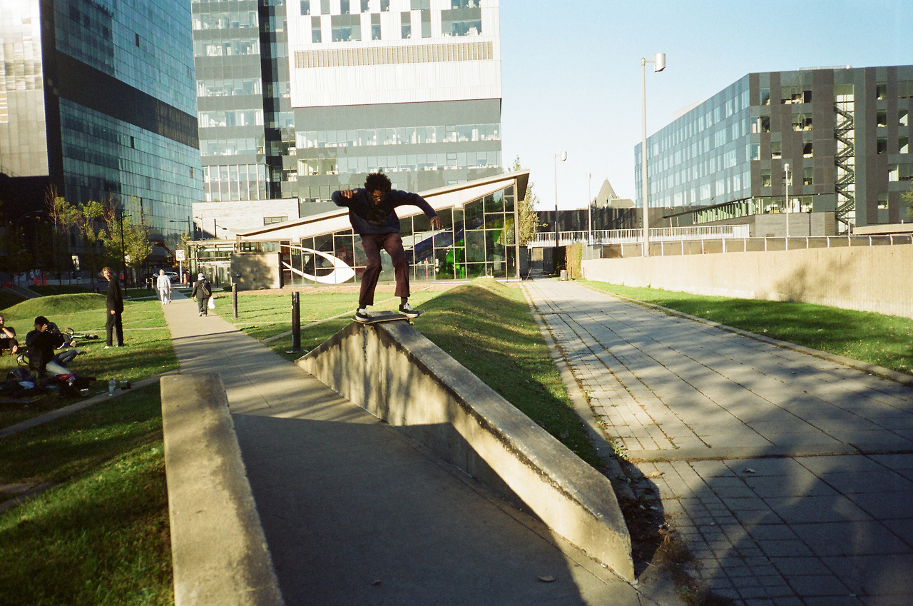 Zack goes up to Canada, and then back down to the States. Zack goes up on this board slide, and then back down to the ground. Photo via Monster Children .