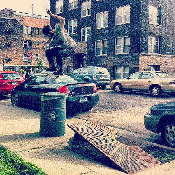 Pat jumps this trash can while skating switch. 