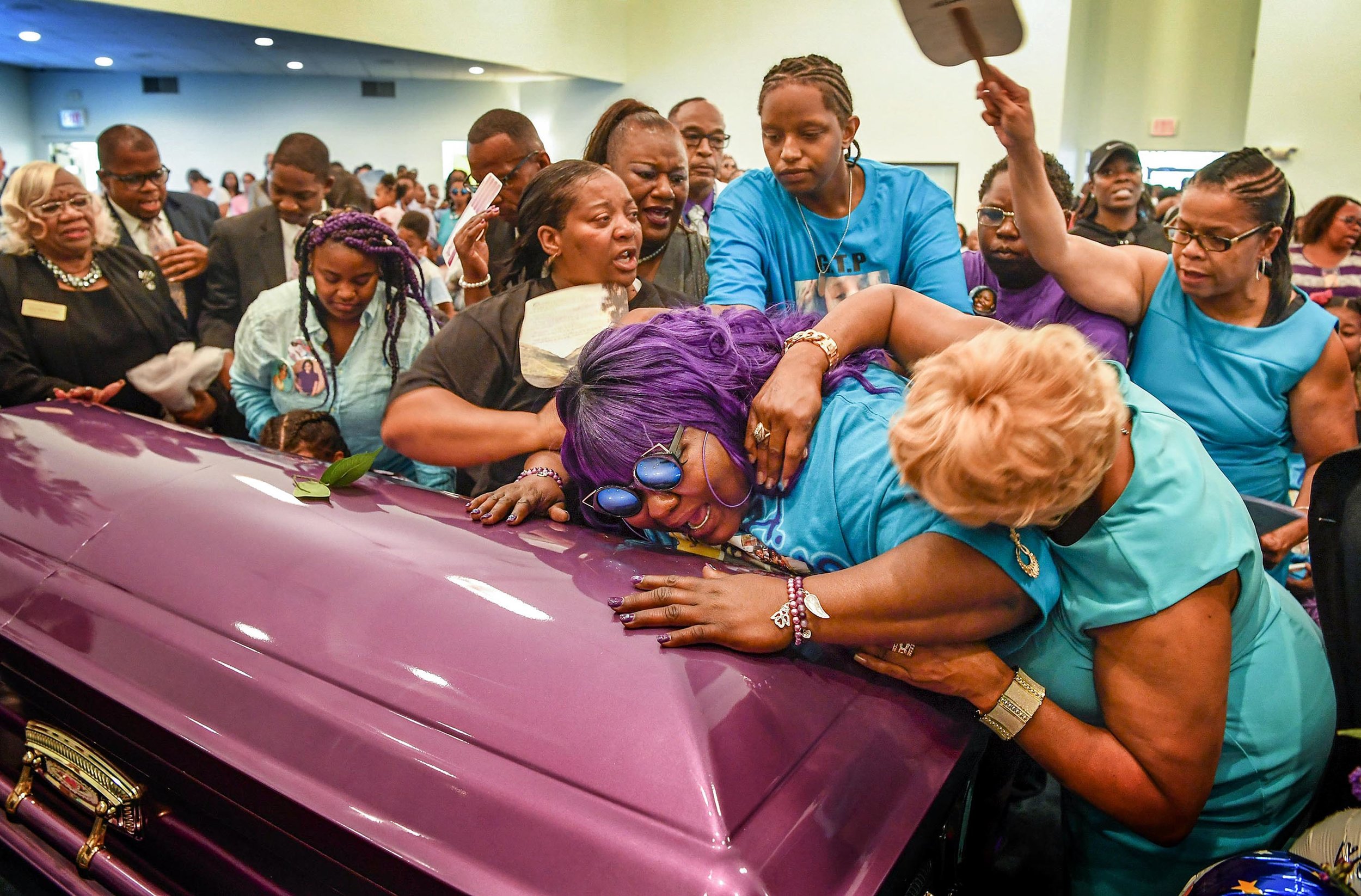 Friends and family try to comfort Tika Begley as they close her daughter Debrianah Begley's casket during the funeral at the Bethesda Original Church of God in Nashville, Tenn., Saturday, October 14, 2017.