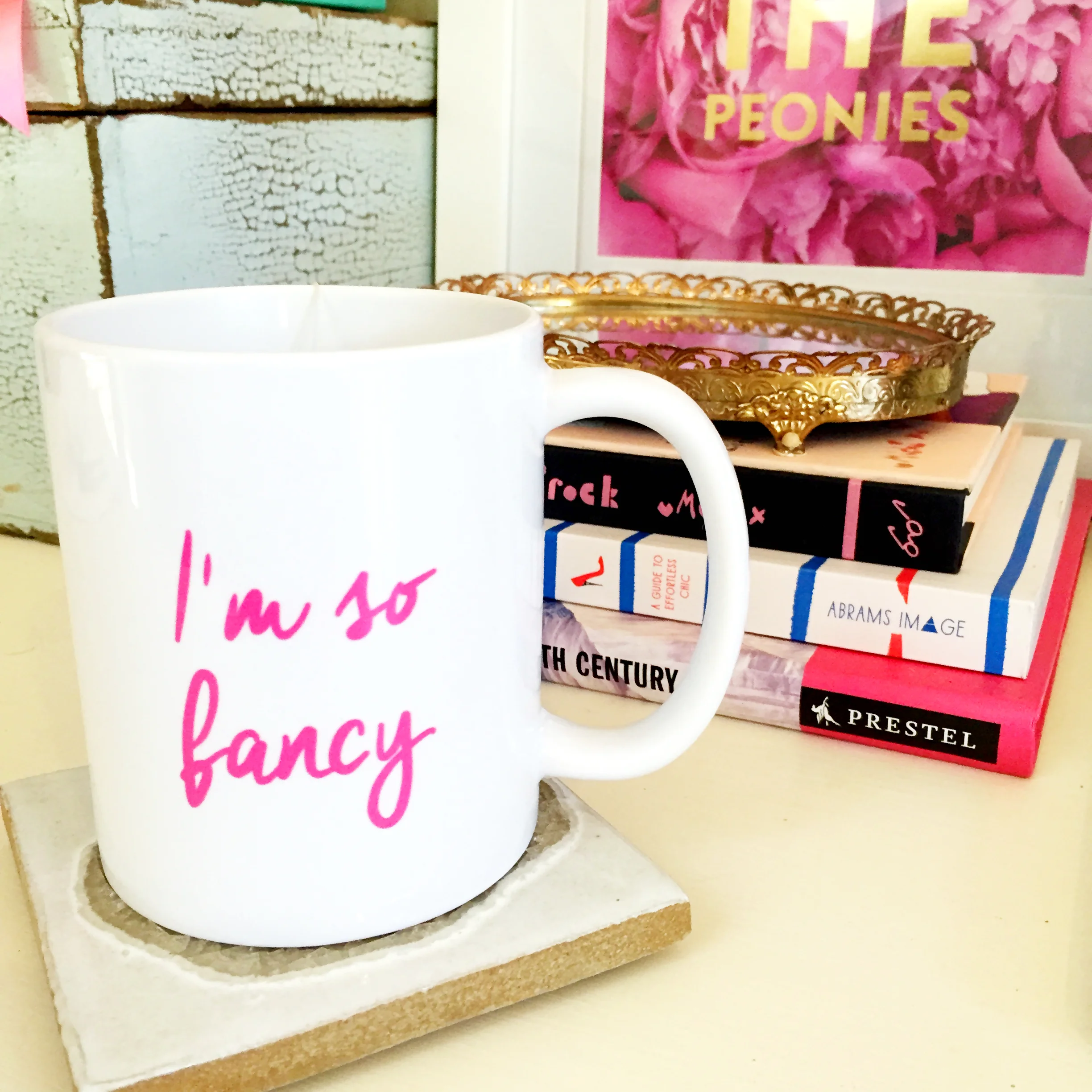 Mug: c/o Lola Accessory Boutique. Coaster: Anthropologie. Books: Marshall's. Tray: Antique. 