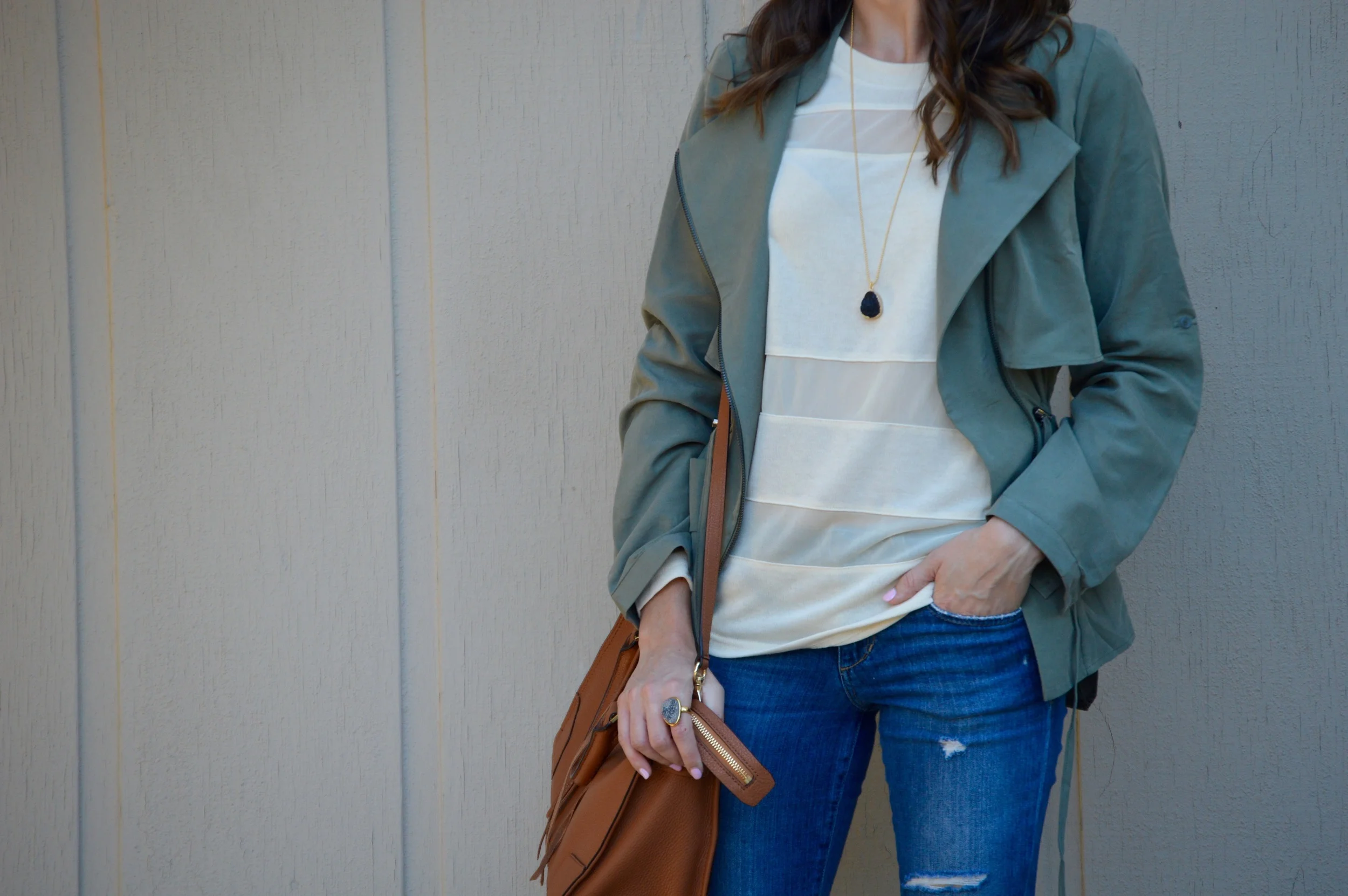 Shop the Look Below. Top: c/o Pink Blush . Jacket: c/o Pink Blush . Jeans: Joe's. Bag: Rebecca Minkoff . Necklace: c/o BaubleBar . Ring: c/o BaubleBar. Boots: Cole Haan . Sunglasses: Ray-Ban. 