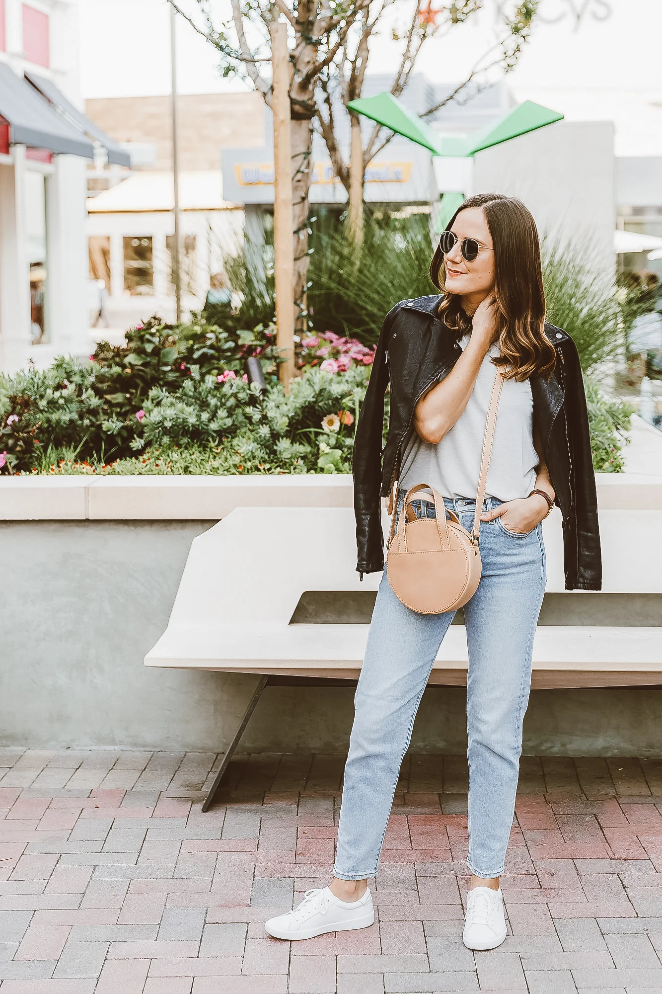 jeans with sneakers and leather jacket