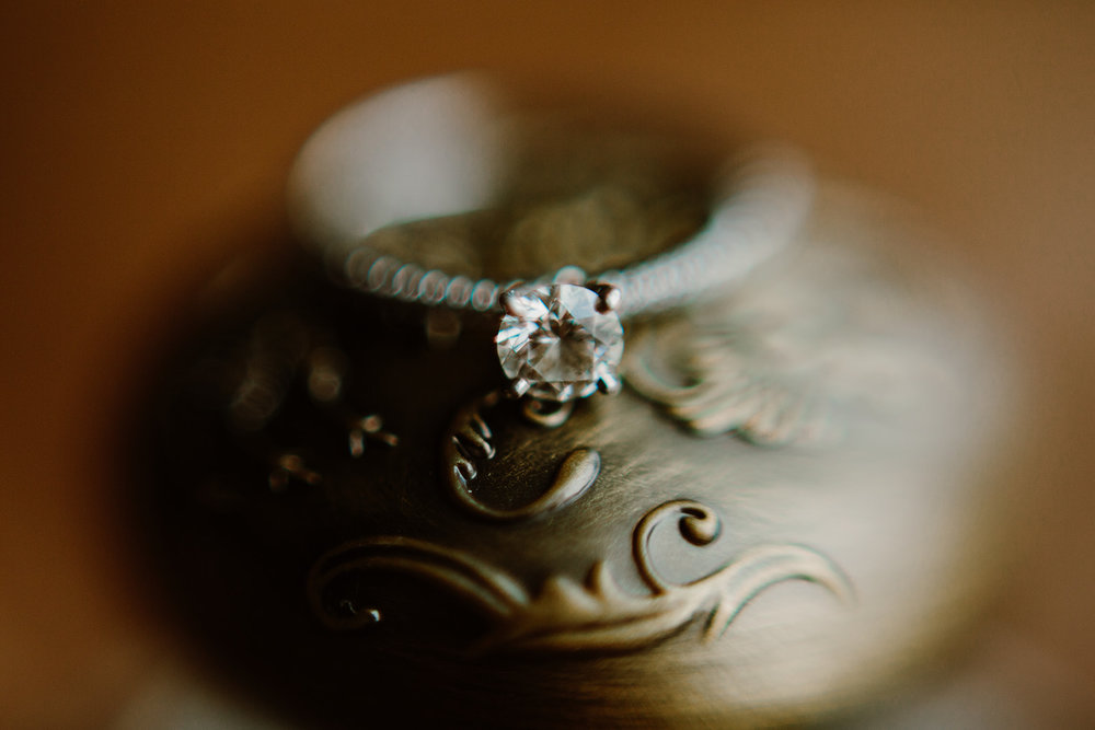  Ring shot. Bride and groom getting ready at the Phoenix Park Hotel, Washington D.C. Irish wedding with green and gold accents. Sarah Mattozzi Photography. 