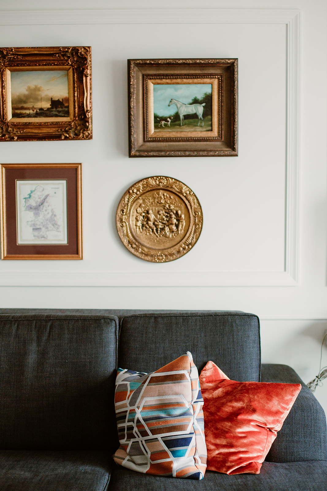  Gallery wall with gold frames above a velvet couch. Bride and groom getting ready at the Phoenix Park Hotel, Washington D.C. Irish wedding with green and gold accents. Sarah Mattozzi Photography. 