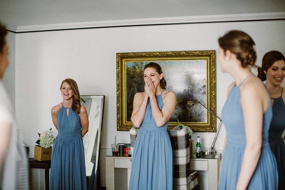  First look with bridesmaids. Bride and groom getting ready at the Phoenix Park Hotel, Washington D.C. Irish wedding with green and gold accents. Sarah Mattozzi Photography. 