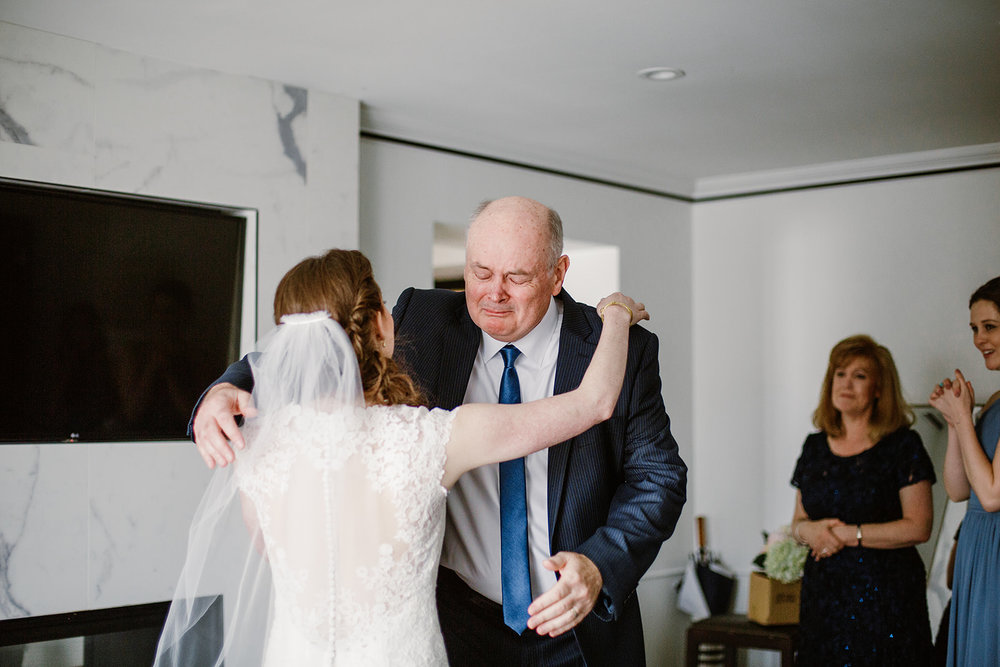  First look with father of the bride. Bride and groom getting ready at the Phoenix Park Hotel, Washington D.C. Irish wedding with green and gold accents. Sarah Mattozzi Photography. 