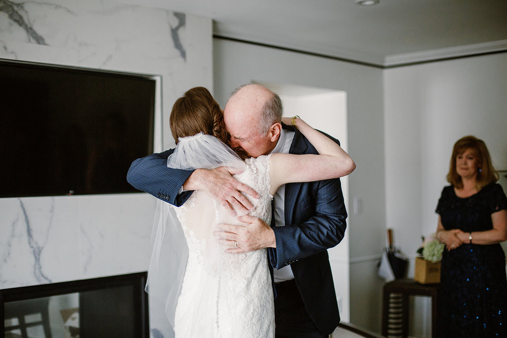  First look with father of the bride. Bride and groom getting ready at the Phoenix Park Hotel, Washington D.C. Irish wedding with green and gold accents. Sarah Mattozzi Photography. 