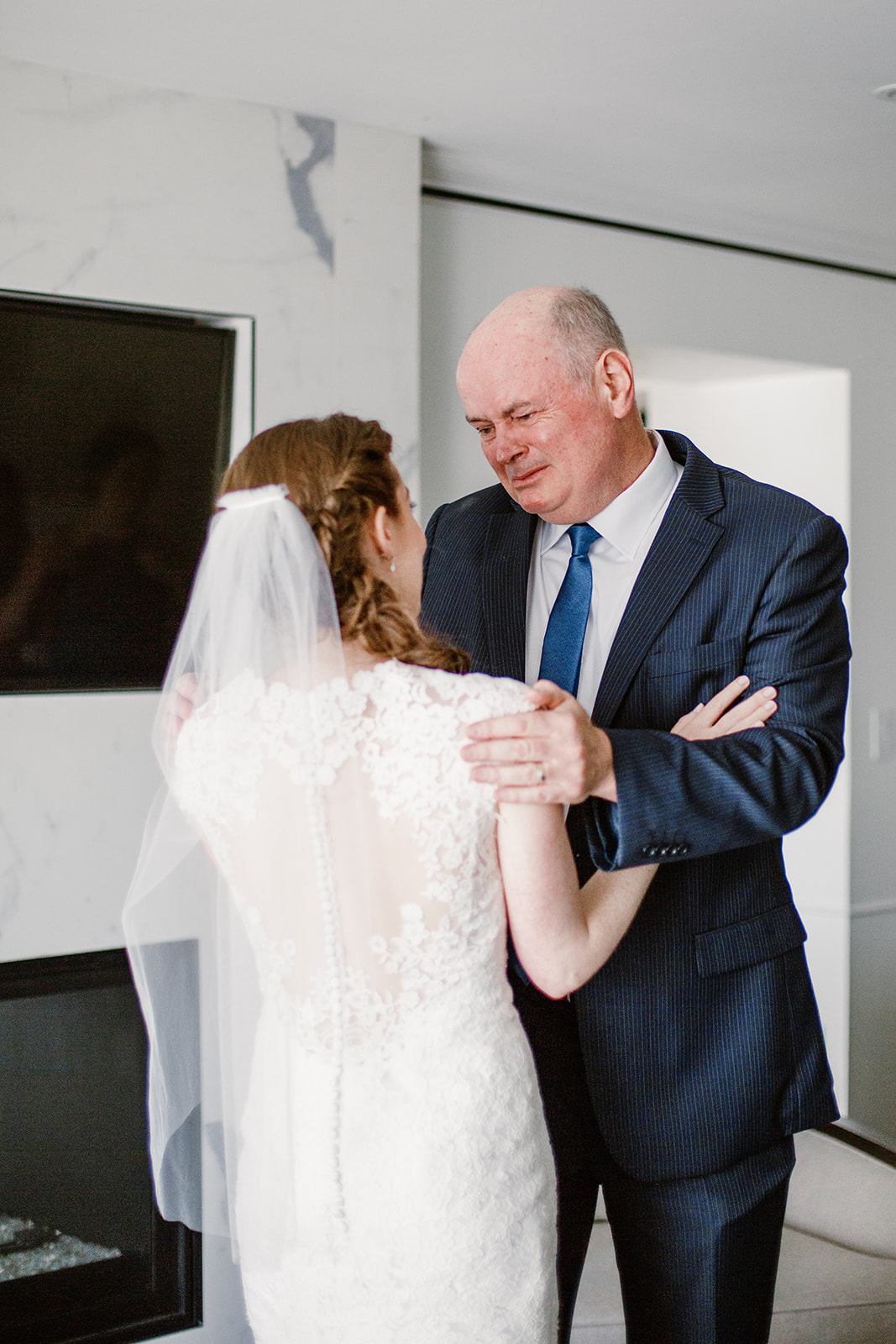  First look with father of the bride. Bride and groom getting ready at the Phoenix Park Hotel, Washington D.C. Irish wedding with green and gold accents. Sarah Mattozzi Photography. 