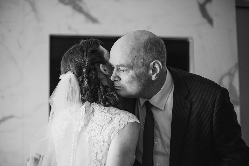  First look with father of the bride. Bride and groom getting ready at the Phoenix Park Hotel, Washington D.C. Irish wedding with green and gold accents. Sarah Mattozzi Photography. 