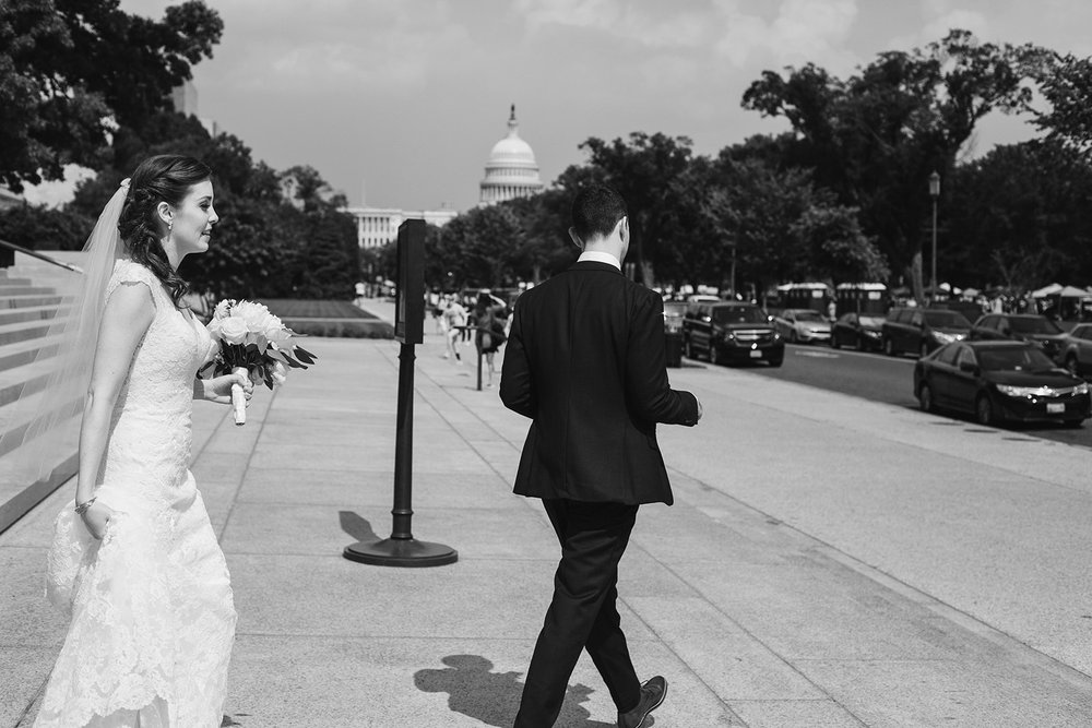  Bride and groom wedding portraits at the National Gallery of Art Museum, Washington D.C. with the Capitol in the background. Irish wedding with green and gold accents. Sarah Mattozzi Photography. 