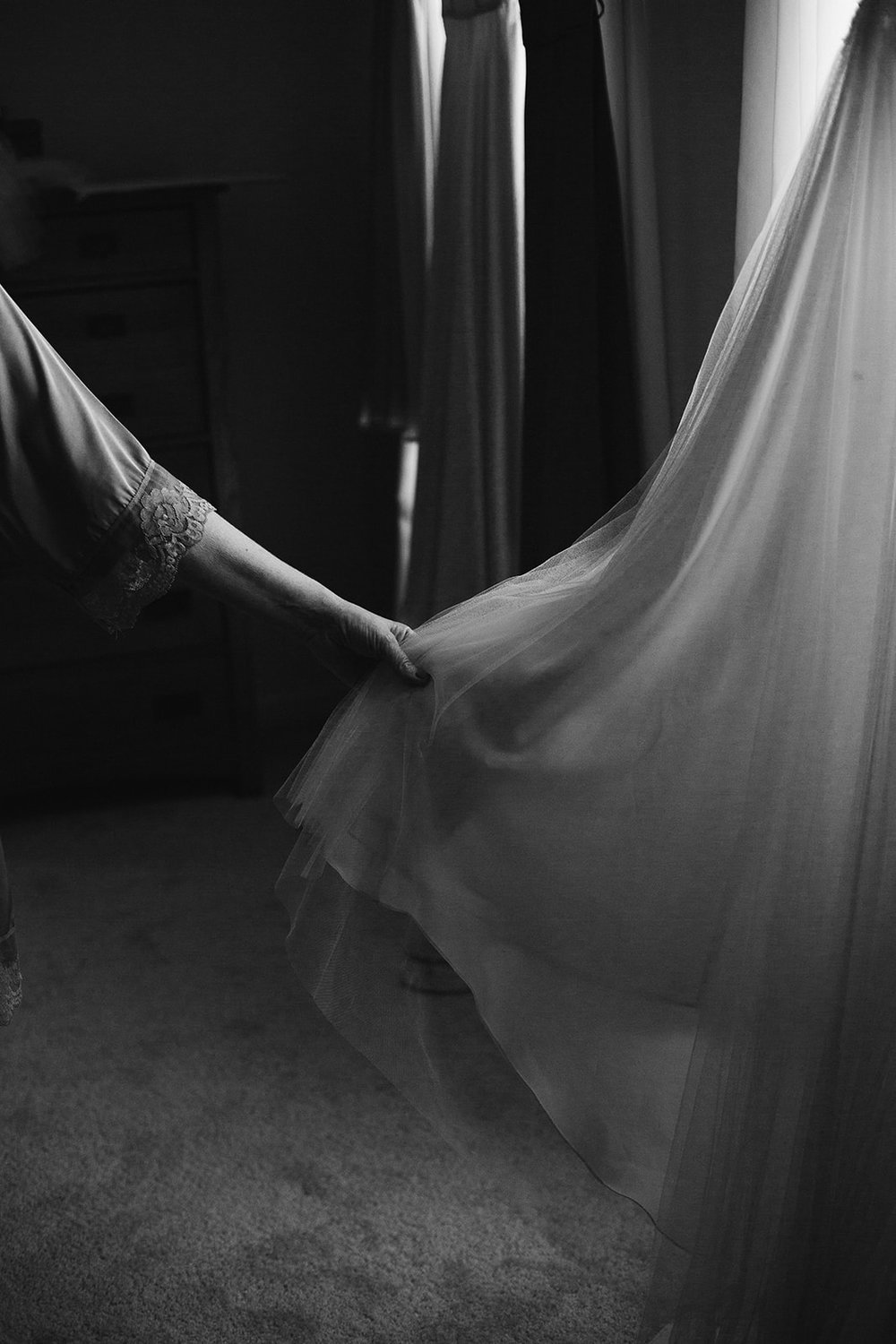  Detail of a hand adjusting wedding dress | Intimate Wedding | Fredericksburg, VA | Sarah Mattozzi Photography 