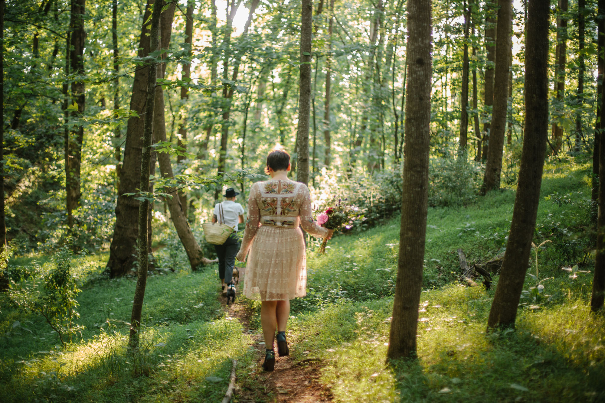  Adventurous woodland elopement in Charlottesville, VA with only the couple and their dachshund dogs. Embroidered wedding dress, wildflower inspired bouquet, and handwritten vows. Sarah Mattozzi Photography. 