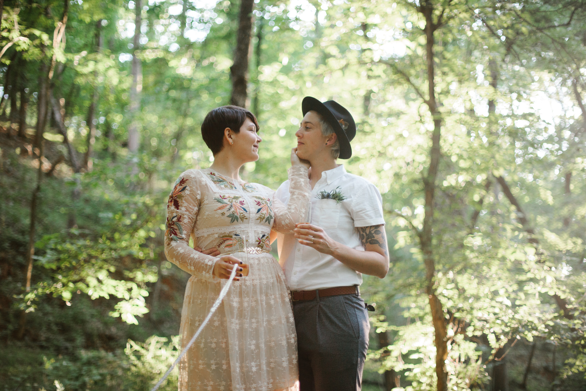  Adventurous woodland elopement in Charlottesville, VA with only the couple and their dachshund dogs. Embroidered wedding dress, wildflower inspired bouquet, and handwritten vows. Sarah Mattozzi Photography. 