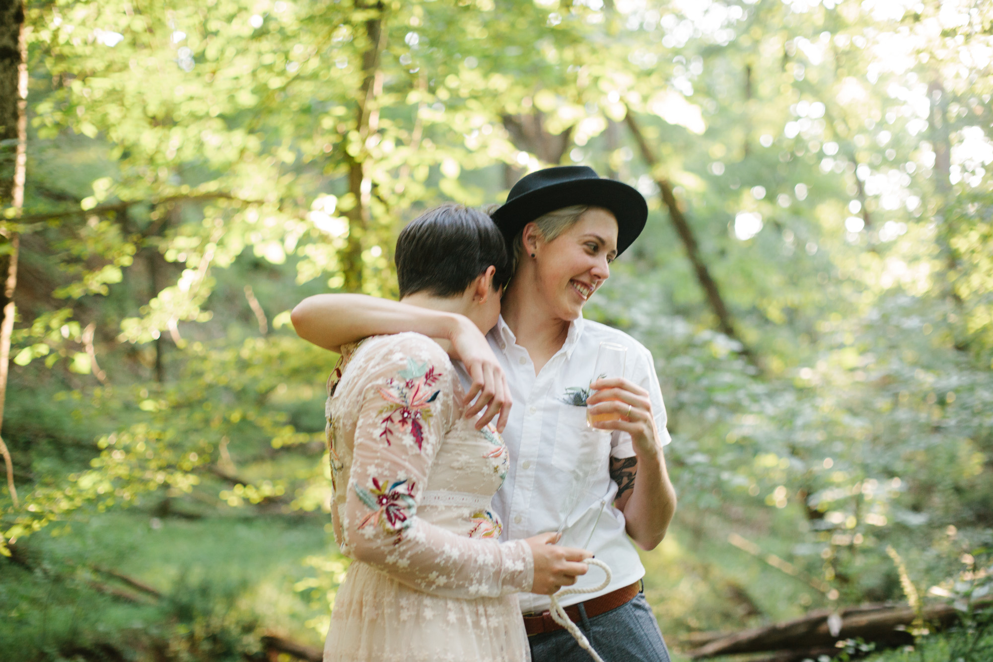  Adventurous woodland elopement in Charlottesville, VA with only the couple and their dachshund dogs. Embroidered wedding dress, wildflower inspired bouquet, and handwritten vows. Sarah Mattozzi Photography. 