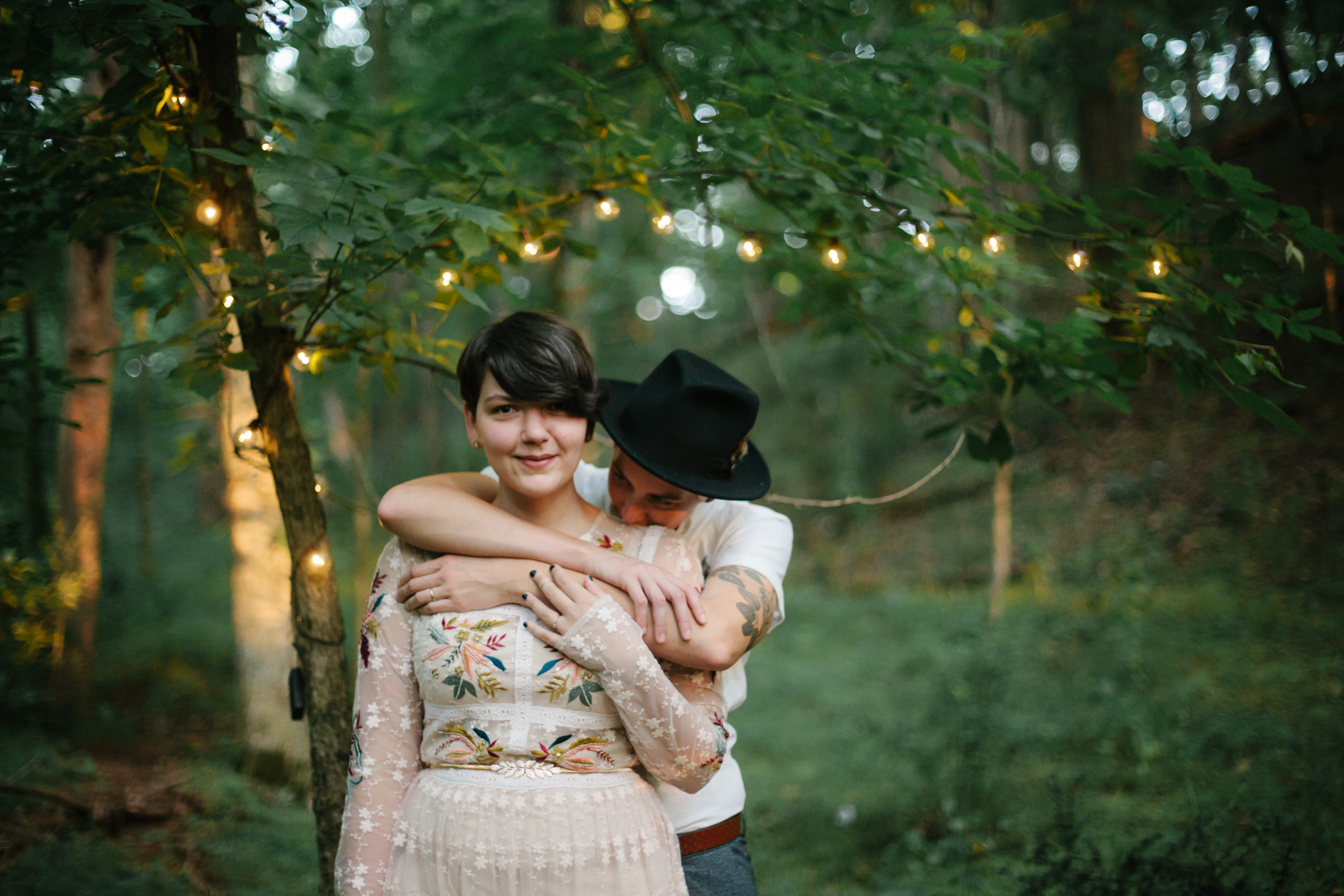  Adventurous woodland elopement in Charlottesville, VA with only the couple and their dachshund dogs. Embroidered wedding dress, wildflower inspired bouquet, and handwritten vows. Sarah Mattozzi Photography. 