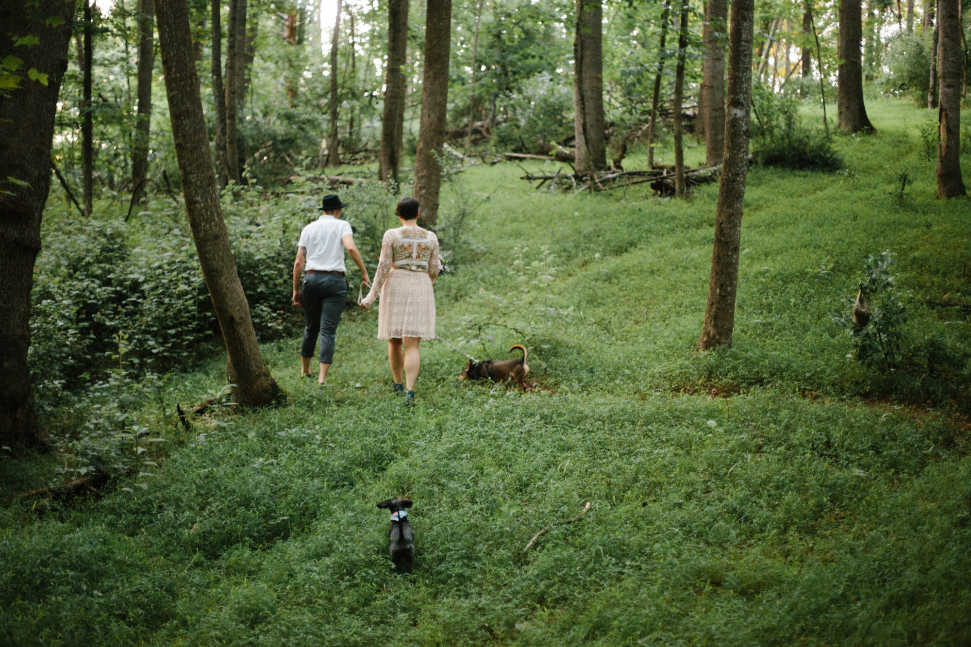  Adventurous woodland elopement in Charlottesville, VA with only the couple and their dachshund dogs. Embroidered wedding dress, wildflower inspired bouquet, and handwritten vows. Sarah Mattozzi Photography. 