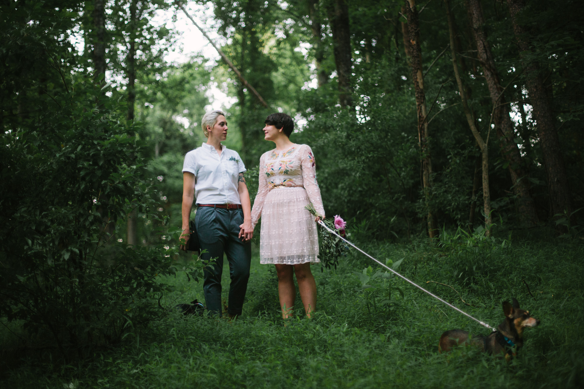  Adventurous woodland elopement in Charlottesville, VA with only the couple and their dachshund dogs. Embroidered wedding dress, wildflower inspired bouquet, and handwritten vows. Sarah Mattozzi Photography. 