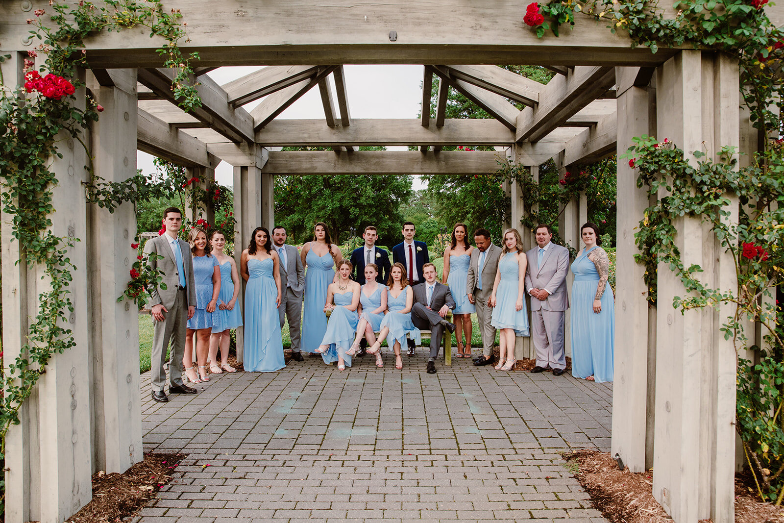  Light blue bridesmaids dresses. Vegan wedding at the Norfolk Botanical Gardens, Norfolk, VA. Rose garden and plant inspired wedding on the first day of Pride month. Sarah Mattozzi Photography. 
