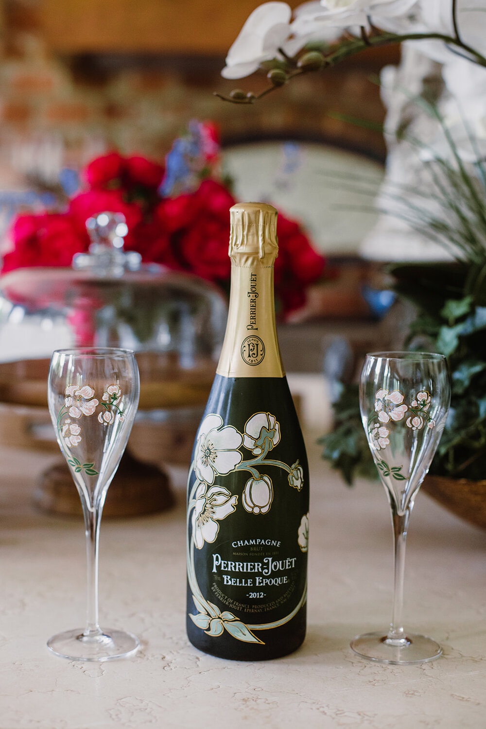  Bottle of Perrier-Jouet Belle Epoque Brut 2012 champagne. Intimate Italian villa elopement at Monteventoso in Madison, Virginia. 