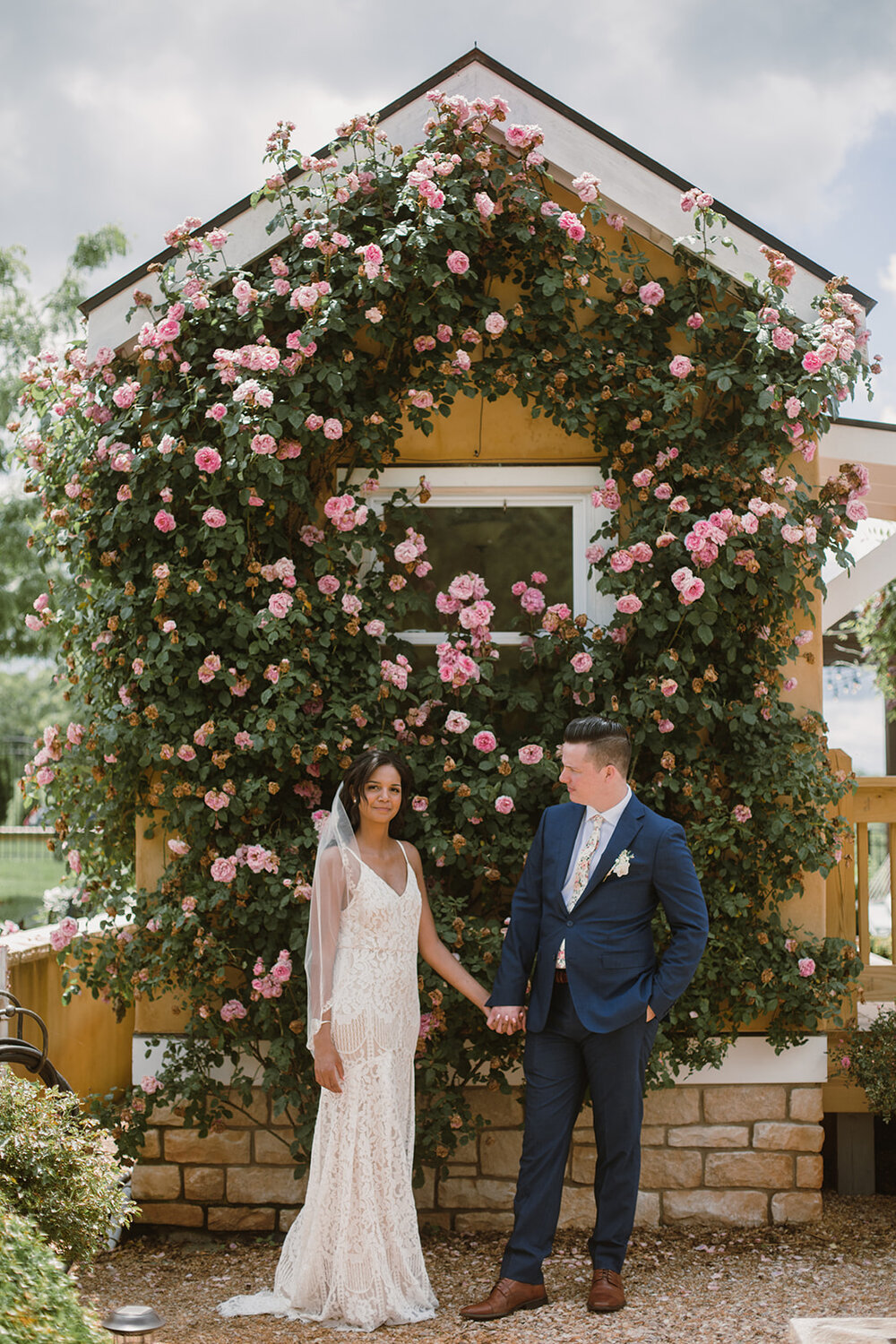  Bride and groom portraits with climbing roses in a garden. Intimate Italian villa elopement at Monteventoso in Madison, Virginia. 