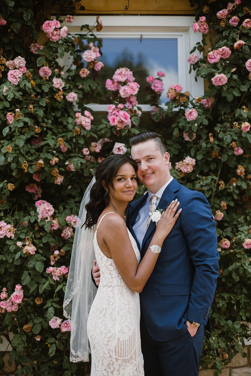 Bride and groom portraits with climbing roses in a garden. Intimate Italian villa elopement at Monteventoso in Madison, Virginia. 