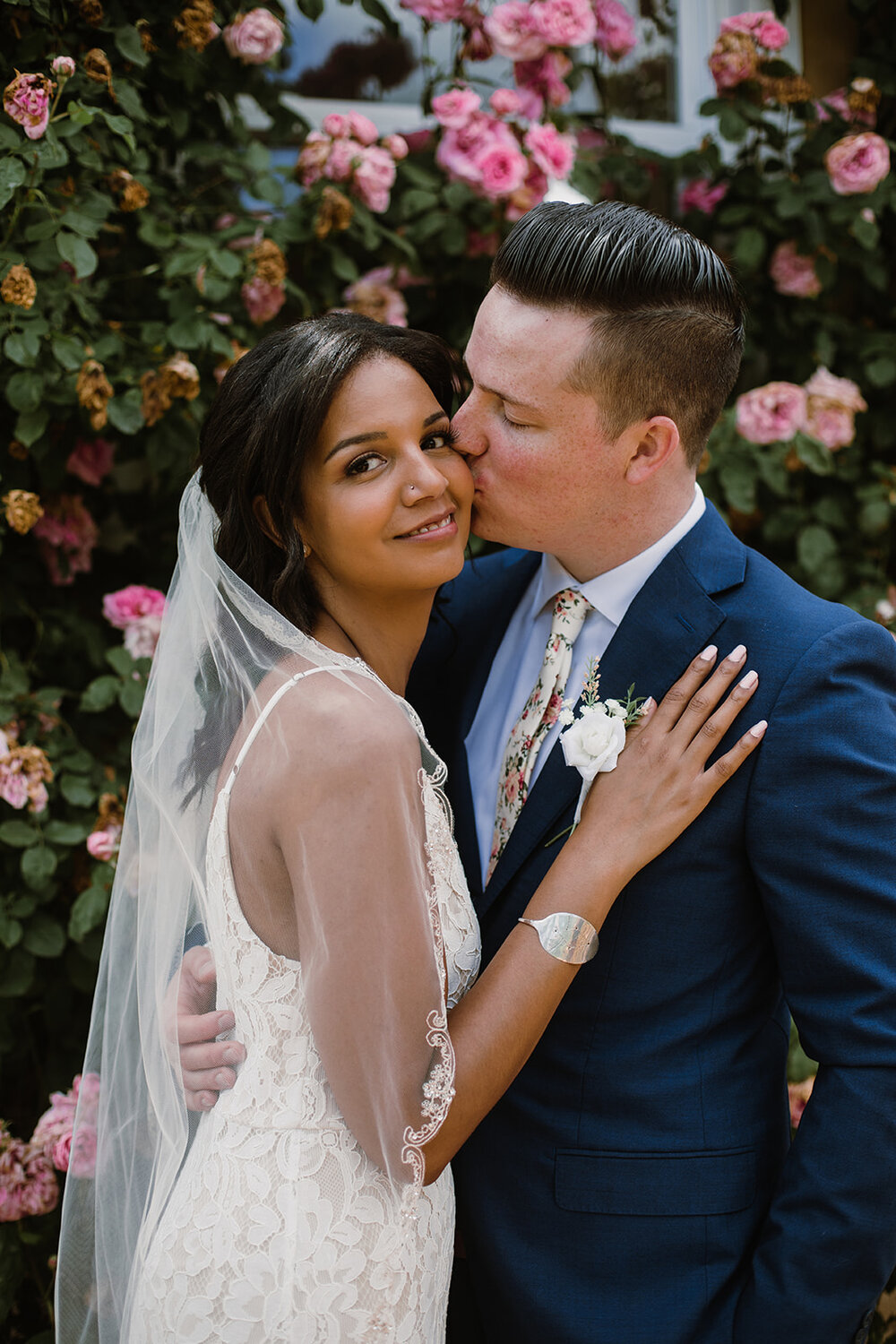  Bride and groom portraits with climbing roses in a garden. Intimate Italian villa elopement at Monteventoso in Madison, Virginia. 