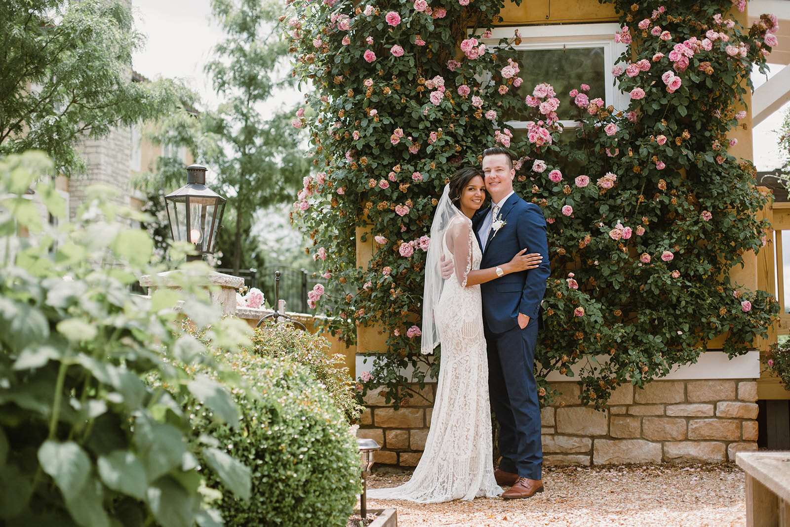  Bride and groom portraits with climbing roses in a garden. Intimate Italian villa elopement at Monteventoso in Madison, Virginia. 