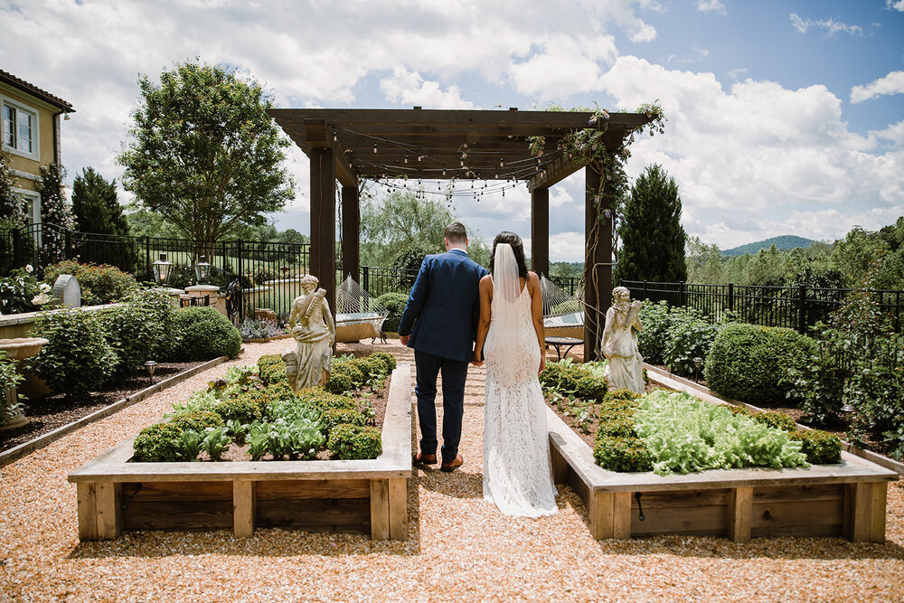  Bride and groom portraits with climbing roses in a garden. Intimate Italian villa elopement at Monteventoso in Madison, Virginia. 