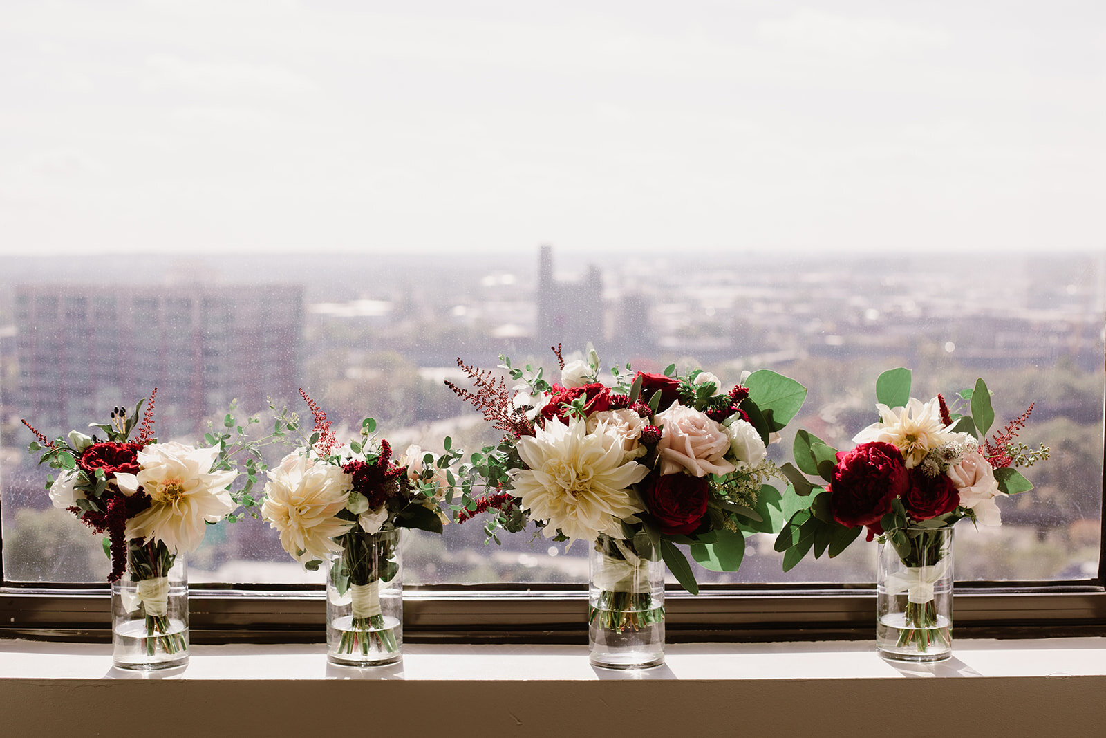 Cafe au lait dahlias and red peony wedding florals | Black tie wedding with a red tux and custom Anne Barge gown | Romantic wedding at St. Bridget and The Omni Hotel in Richmond, VA.