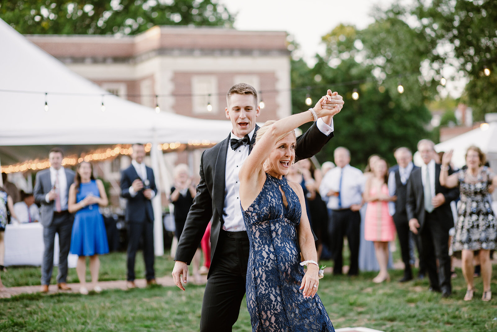  Groom and Mother Dancing | Sarah Mattozzi Photography | Ball Gown Wedding dress and Black Tux | Outdoor Classic Wedding at Third Church and Veritas School | Richmond Wedding Photographer 
