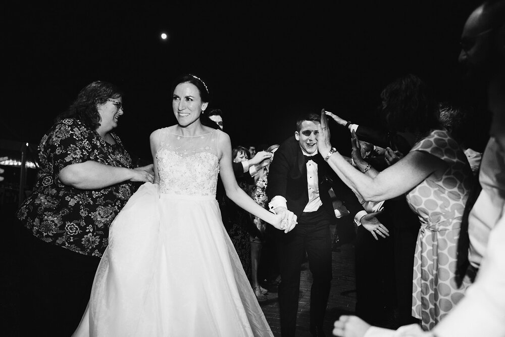  Bride and Groom Exit | Sarah Mattozzi Photography | Ball Gown Wedding dress and Black Tux | Outdoor Classic Wedding at Third Church and Veritas School | Richmond Wedding Photographer 