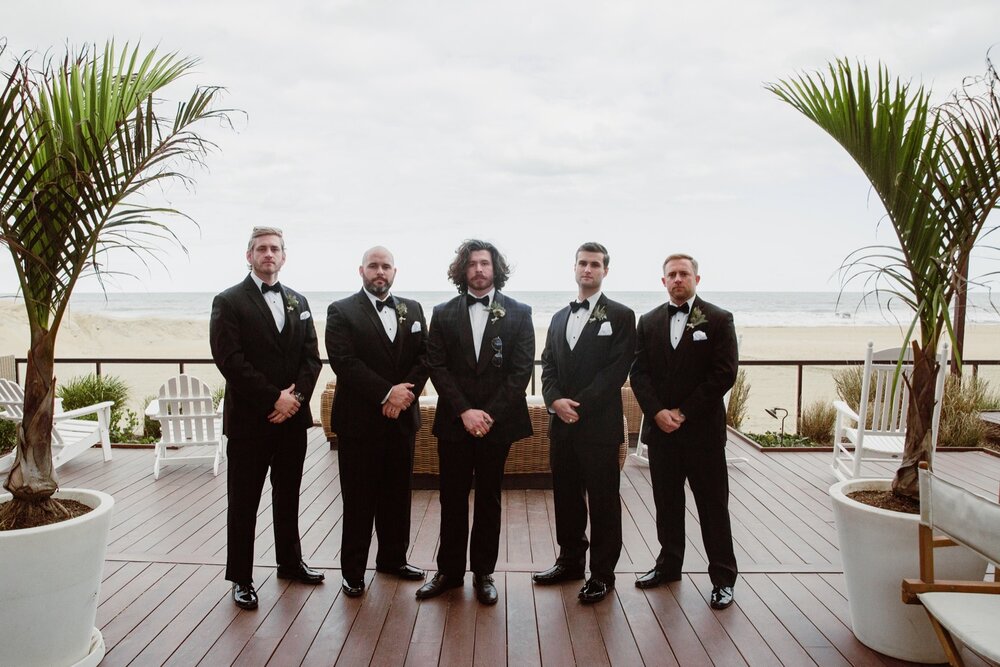  Groomsmen wedding portraits | Sarah Mattozzi Photography | Black tie wedding at The Historic Cavalier Hotel, Virginia Beach | Tropical, elegant wedding inspiration, black tux groom, glam bride, greenery bouquets, sentimental, classic, minimalist wed