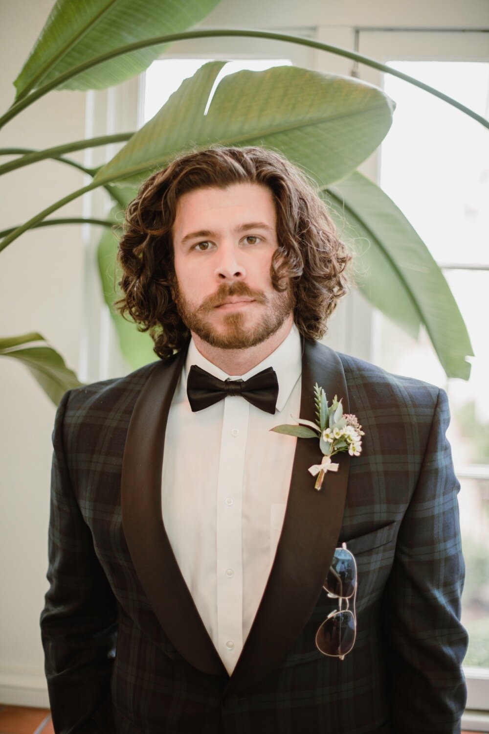  Groom in green and black tartan plaid tux | Sarah Mattozzi Photography | Black tie wedding at The Historic Cavalier Hotel, Virginia Beach | Tropical, elegant wedding inspiration, black tux groom, glam bride, greenery bouquets, sentimental, classic, 