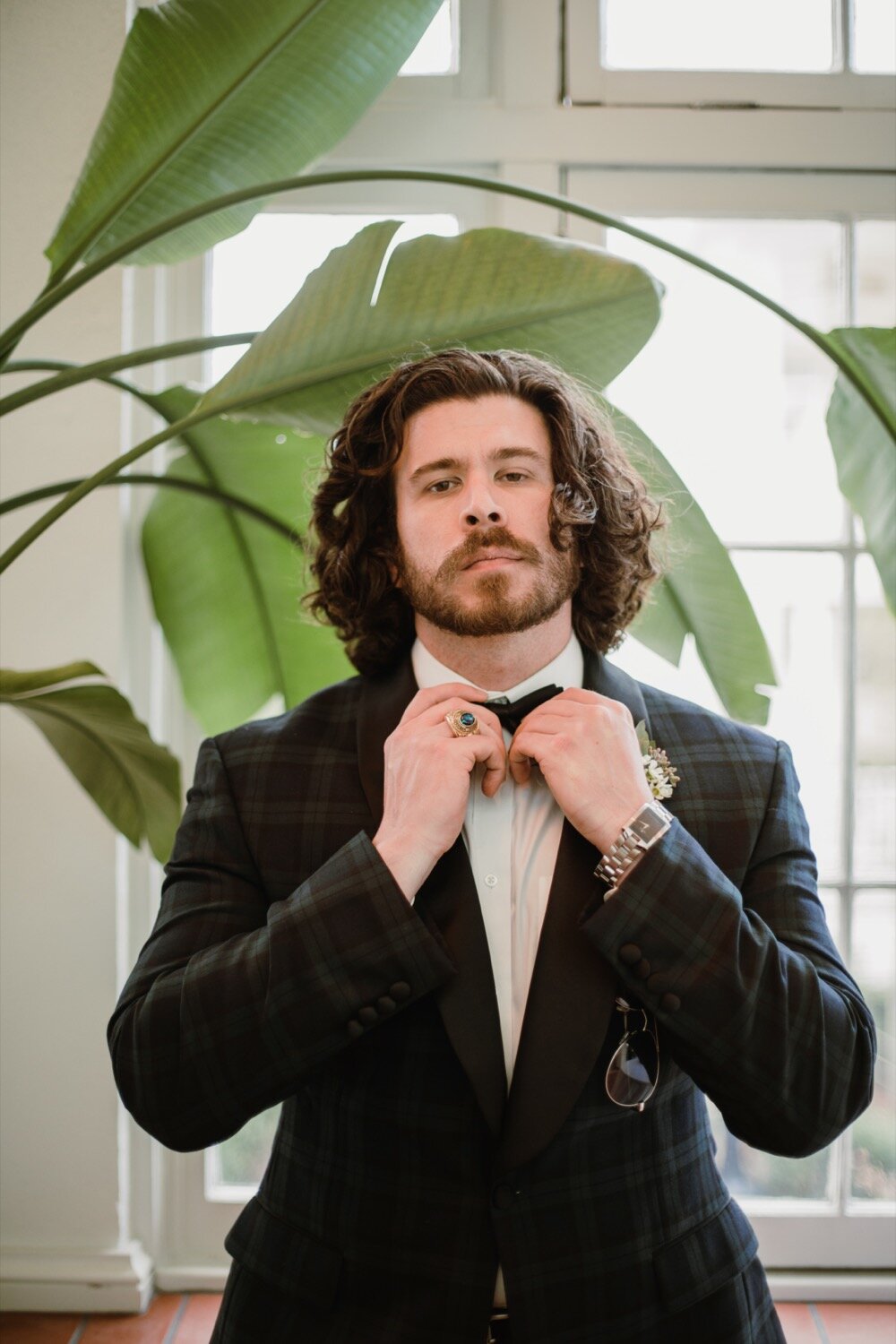  Groom in green and black tartan plaid tux | Sarah Mattozzi Photography | Black tie wedding at The Historic Cavalier Hotel, Virginia Beach | Tropical, elegant wedding inspiration, black tux groom, glam bride, greenery bouquets, sentimental, classic, 