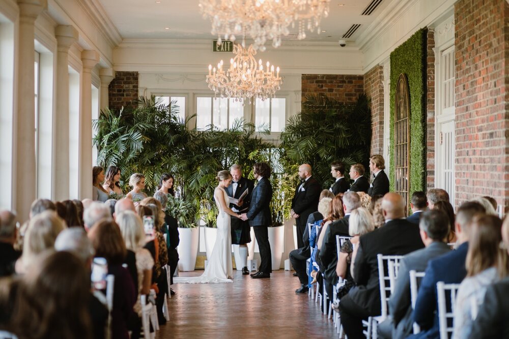  Intimate wedding ceremony | Sarah Mattozzi Photography | Black tie wedding at The Historic Cavalier Hotel, Virginia Beach | Tropical, elegant wedding inspiration, black tux groom, glam bride, greenery bouquets, sentimental, classic, minimalist weddi