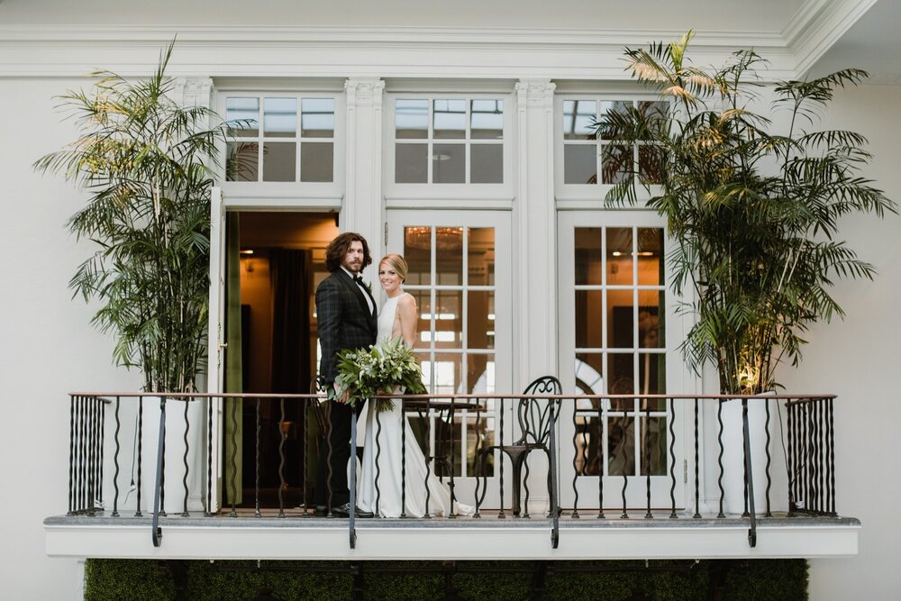  Poolside bride and groom portraits | Sarah Mattozzi Photography | Black tie wedding at The Historic Cavalier Hotel, Virginia Beach | Tropical, elegant wedding inspiration, black tux groom, glam bride, greenery bouquets, sentimental, classic, minimal