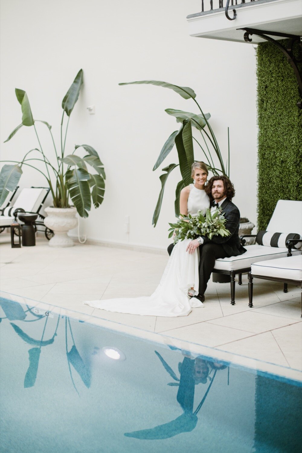  Poolside bride and groom portraits | Sarah Mattozzi Photography | Black tie wedding at The Historic Cavalier Hotel, Virginia Beach | Tropical, elegant wedding inspiration, black tux groom, glam bride, greenery bouquets, sentimental, classic, minimal