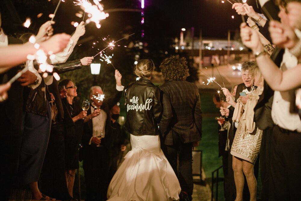  Sparkler exit | Sarah Mattozzi Photography | Black tie wedding at The Historic Cavalier Hotel, Virginia Beach | Tropical, elegant wedding inspiration, black tux groom, glam bride, greenery bouquets, sentimental, classic, minimalist wedding.  